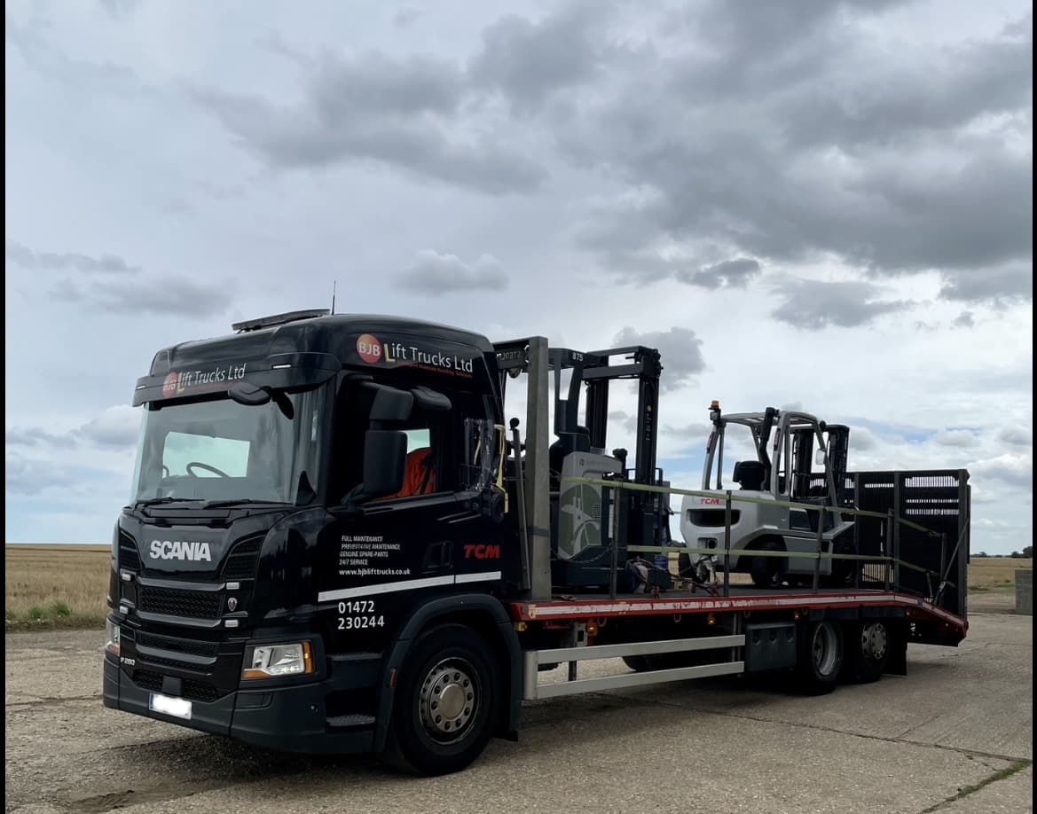 BJB lorry delivering a hired machine.