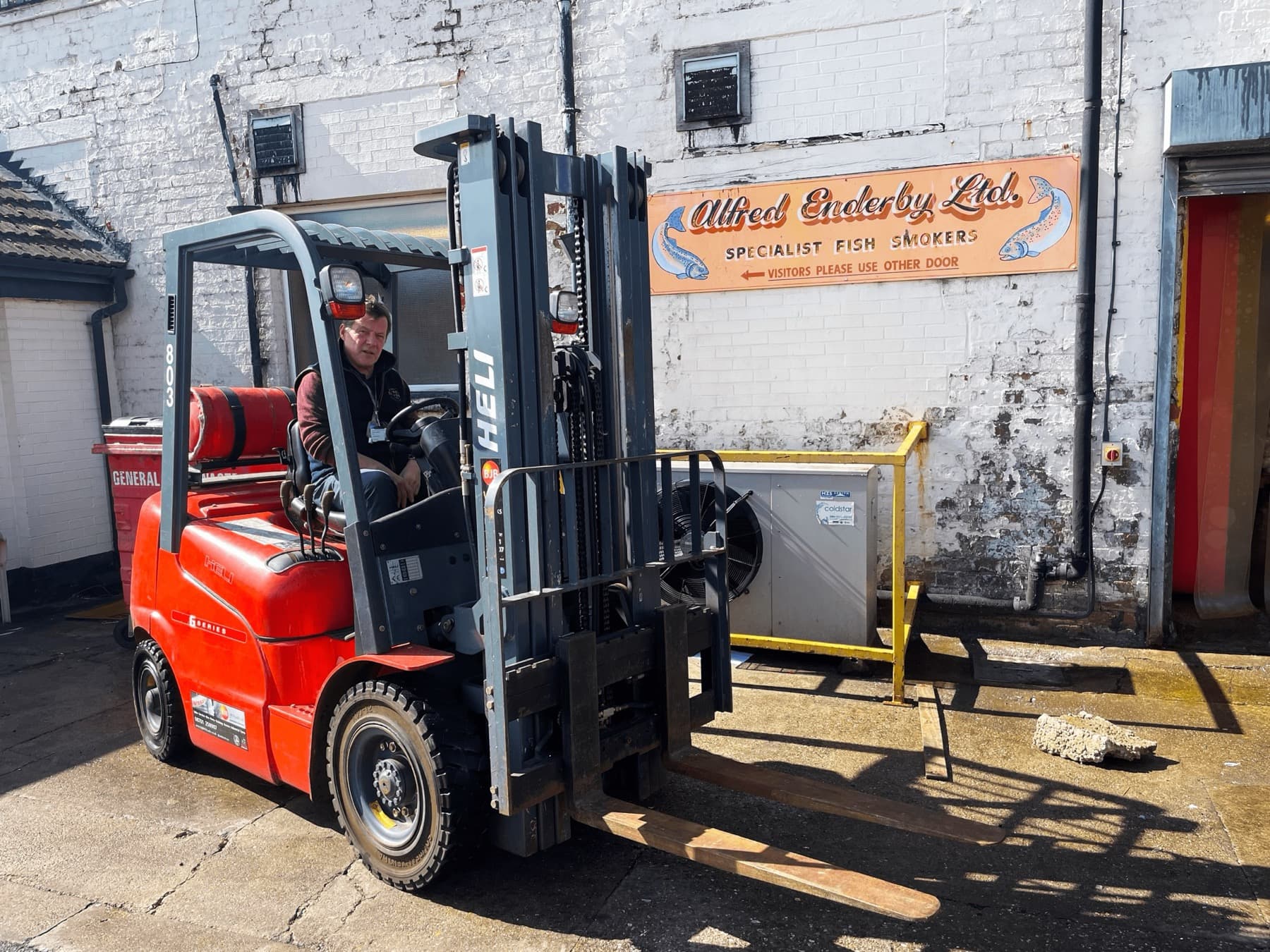 Patrick Salmon of Alfred Enderby with the forklift supplied by BJB.
