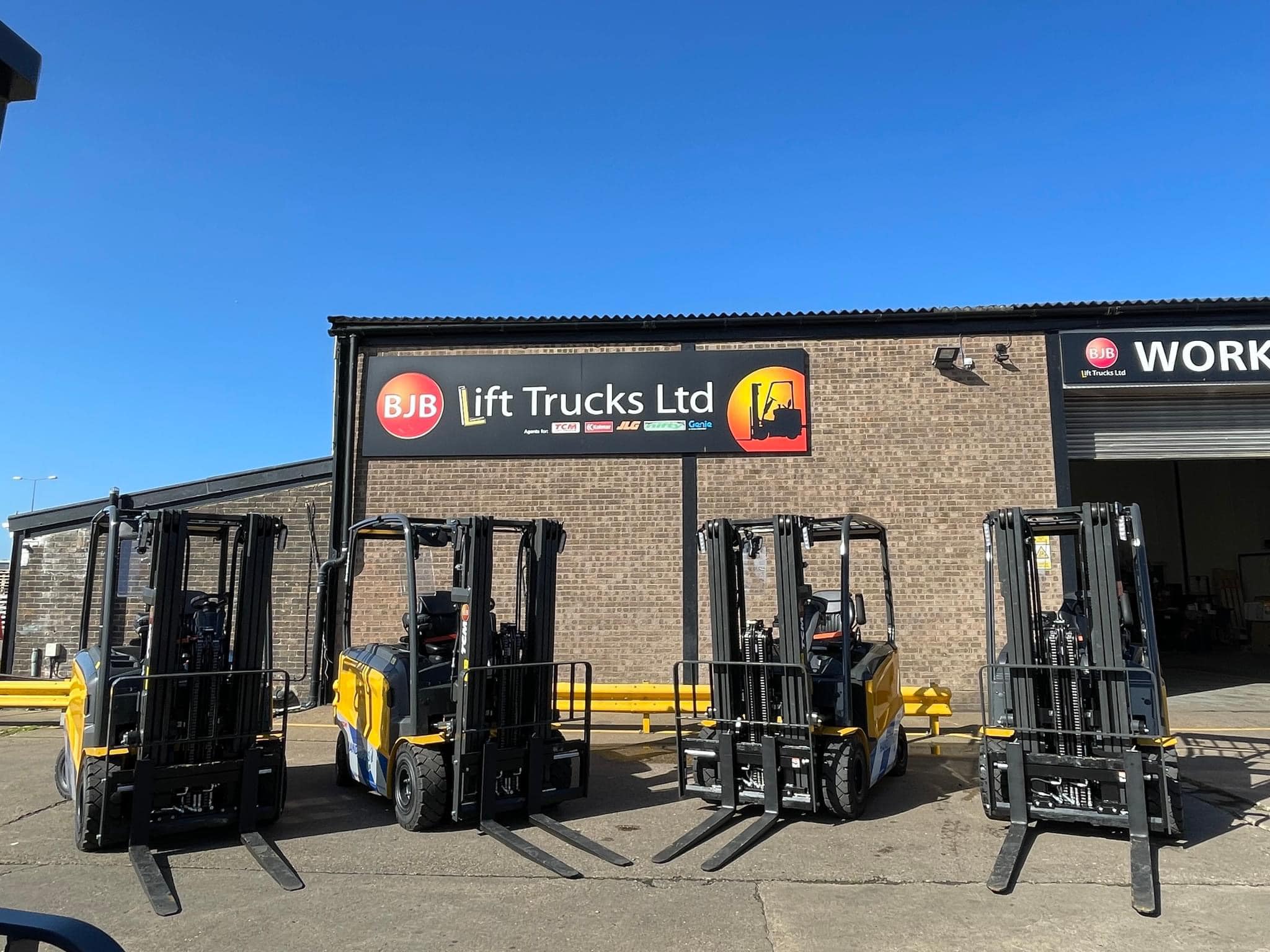 front of bjb with 4 forklifts