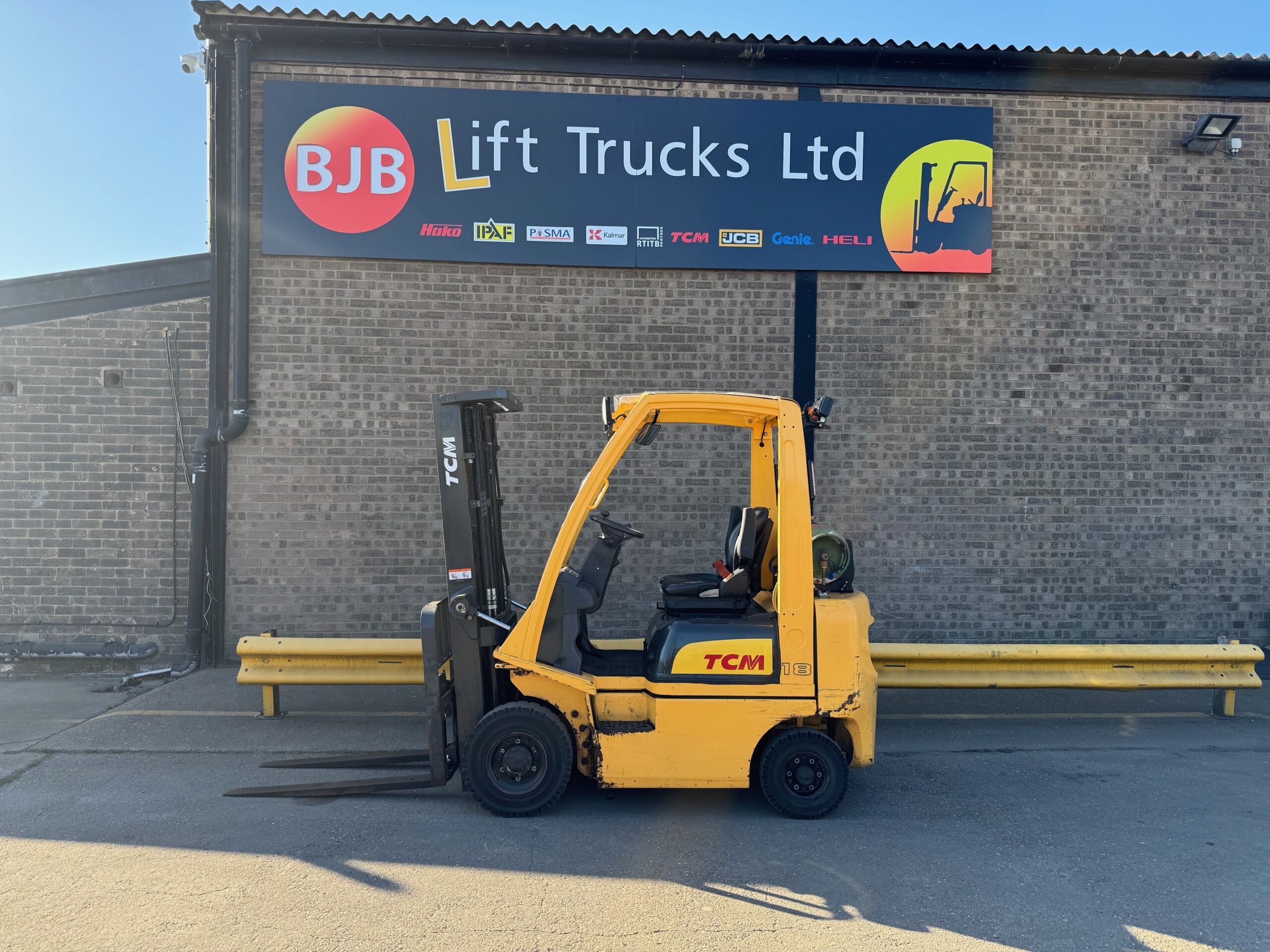 small yellow lift truck tcm brand